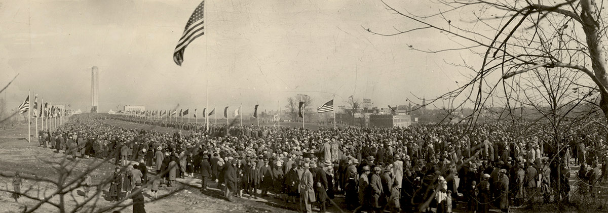 Sepia panorama of crowds at the Liberty Memorial — reflecting early 20th-century public commemorations on November 11th.